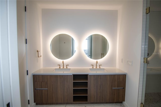 bathroom with vanity and a shower with shower door