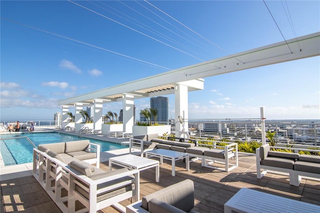 view of patio featuring outdoor lounge area and a community pool