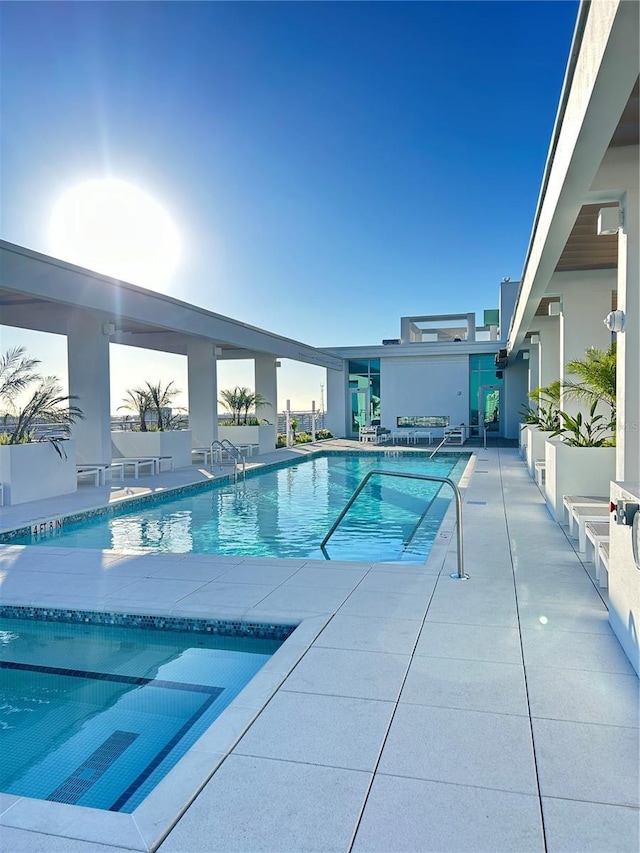 view of swimming pool with a patio area