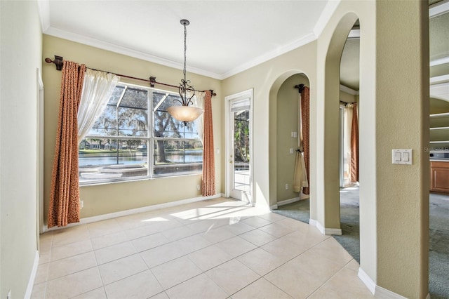 unfurnished dining area with ornamental molding and light tile patterned floors