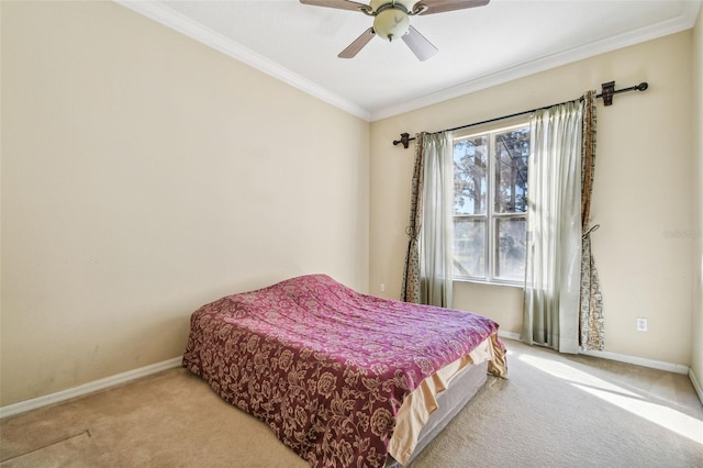 bedroom featuring ornamental molding, carpet floors, and ceiling fan