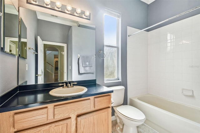 full bathroom featuring vanity, tub / shower combination, tile patterned floors, and toilet