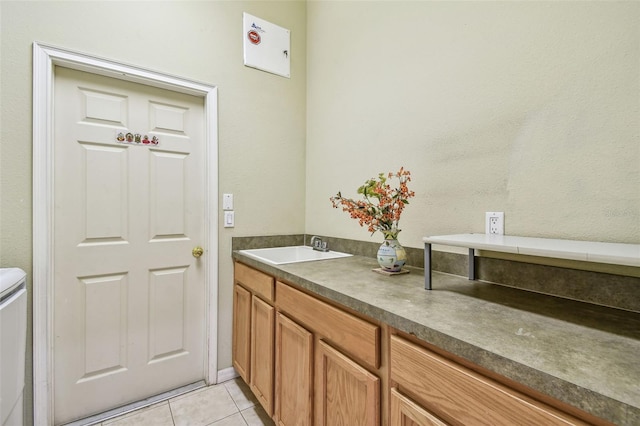 bathroom with tile patterned flooring and vanity