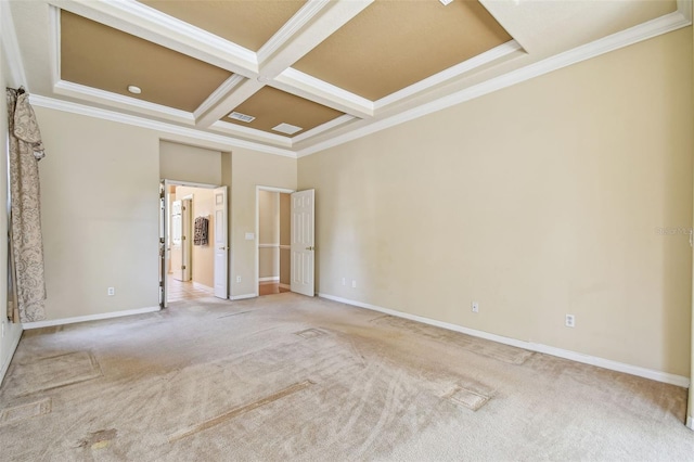 carpeted empty room featuring coffered ceiling, beam ceiling, and crown molding