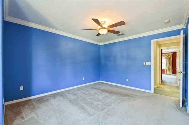 unfurnished room featuring crown molding, carpet flooring, and ceiling fan