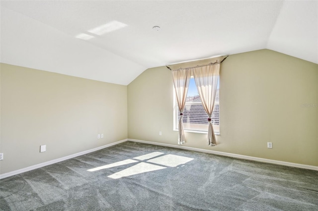 bonus room with lofted ceiling and carpet flooring