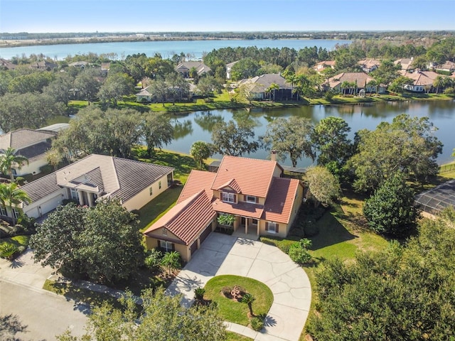 birds eye view of property with a water view