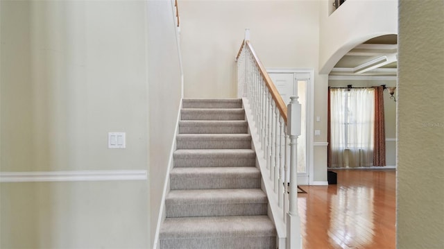 2024 Capri Ln, Mount Dora, FL 32757 - stairway featuring arched walkways, wood finished floors, and crown molding