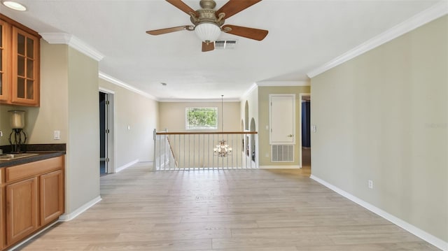 2024 Capri Ln, Mount Dora, FL 32757 - spare room featuring light wood-type flooring, a ceiling fan, and crown molding