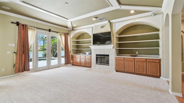 2024 Capri Ln, Mount Dora, FL 32757 - unfurnished living room with light carpet, ornamental molding, a textured ceiling, a fireplace, and recessed lighting