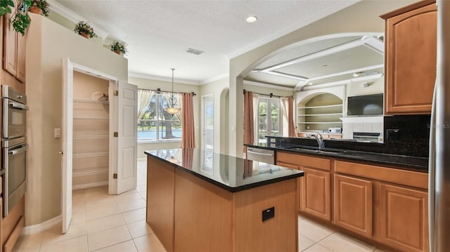 2024 Capri Ln, Mount Dora, FL 32757 - kitchen featuring a center island, light tile patterned floors, ornamental molding, arched walkways, and plenty of natural light