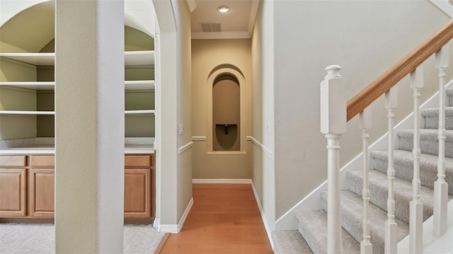 2024 Capri Ln, Mount Dora, FL 32757 - hallway featuring ornamental molding and stairway