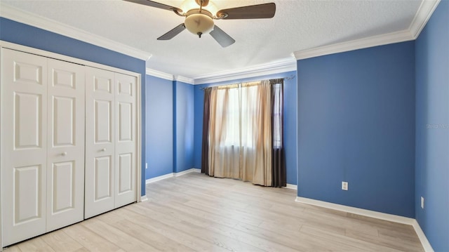 2024 Capri Ln, Mount Dora, FL 32757 - unfurnished bedroom featuring crown molding, a closet, light wood-type flooring, and ceiling fan