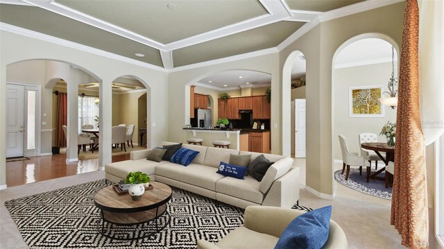2024 Capri Ln, Mount Dora, FL 32757 - living room with arched walkways, crown molding, light colored carpet, and recessed lighting