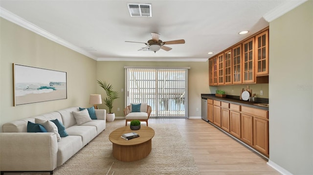 2024 Capri Ln, Mount Dora, FL 32757 - living area featuring ornamental molding, a ceiling fan, light wood finished floors, recessed lighting, and bar with sink
