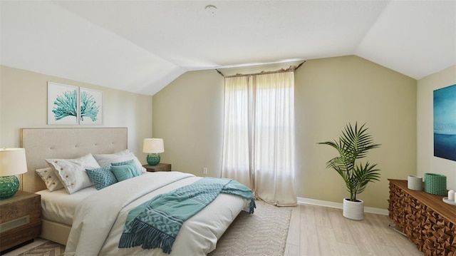 2024 Capri Ln, Mount Dora, FL 32757 - bedroom with vaulted ceiling and light wood-style floors