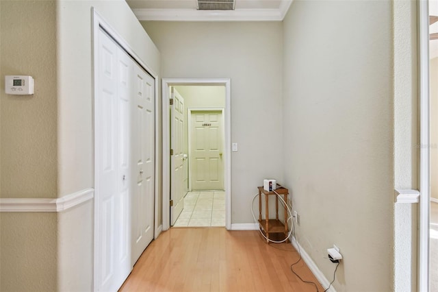 2024 Capri Ln, Mount Dora, FL 32757 - hallway with light wood finished floors and crown molding
