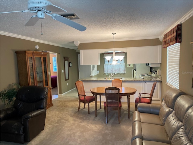 dining area with light carpet, a textured ceiling, and crown molding