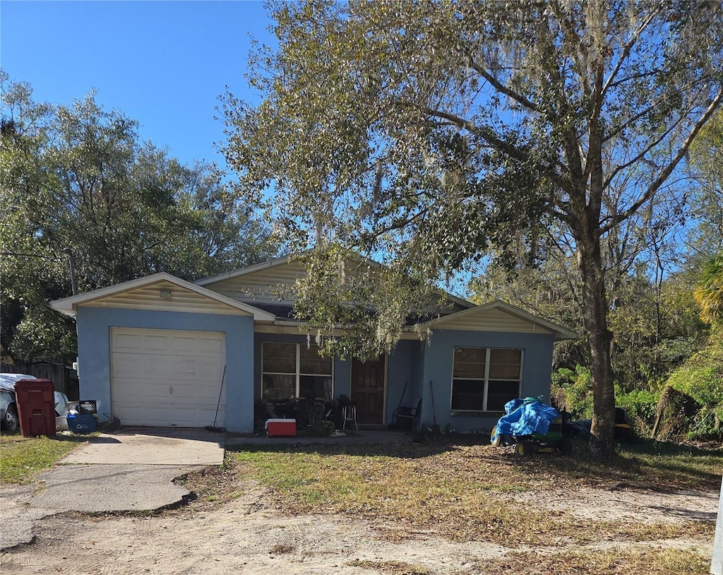 single story home with a garage