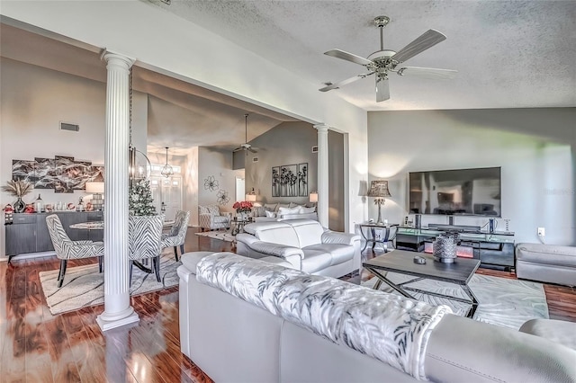 living room featuring ornate columns, a textured ceiling, lofted ceiling, ceiling fan with notable chandelier, and hardwood / wood-style flooring