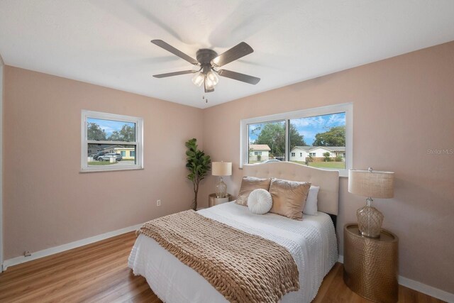 bedroom featuring ceiling fan and light wood-type flooring