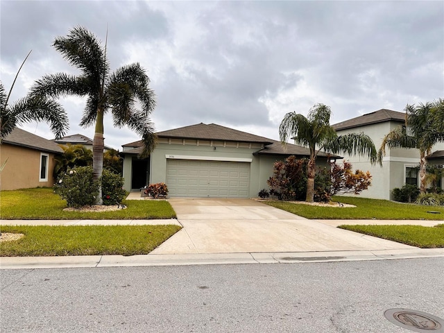 view of front facade featuring a front yard and a garage