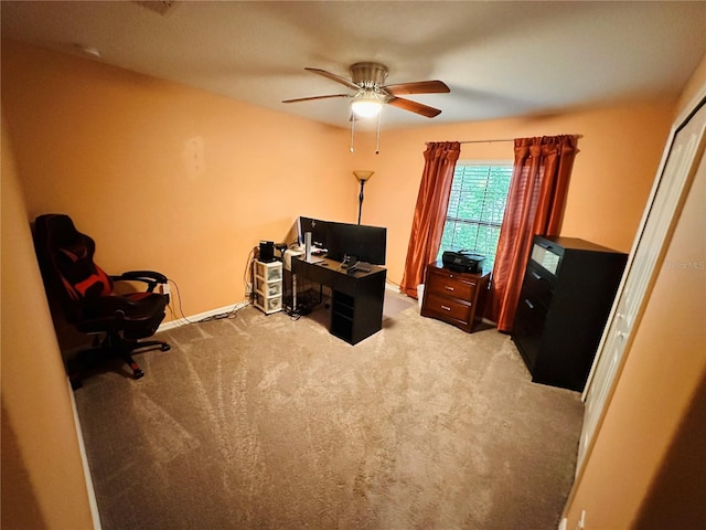 carpeted home office with ceiling fan