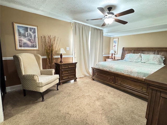 bedroom with ceiling fan, crown molding, light carpet, and a textured ceiling