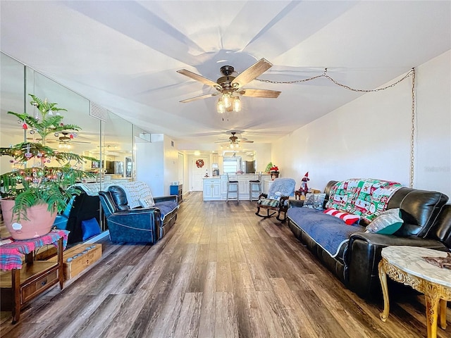 living room with hardwood / wood-style flooring and ceiling fan