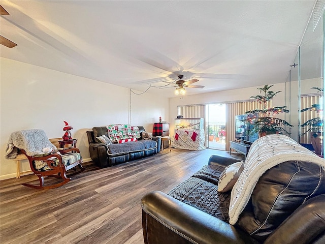 living room with ceiling fan and hardwood / wood-style flooring