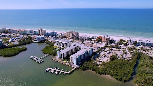 drone / aerial view featuring a view of the beach and a water view