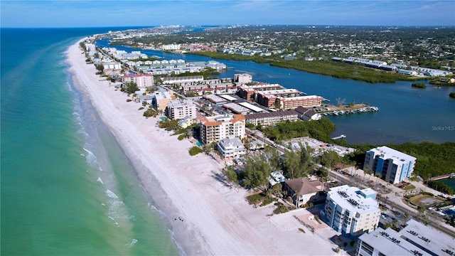 bird's eye view with a water view and a beach view