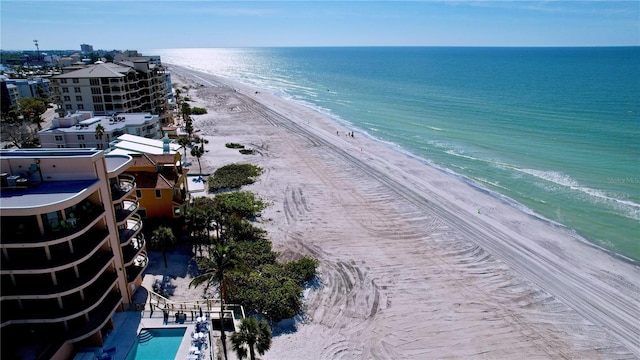 bird's eye view with a water view and a beach view