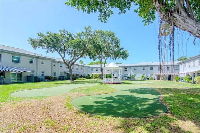 surrounding community featuring a gazebo and a lawn