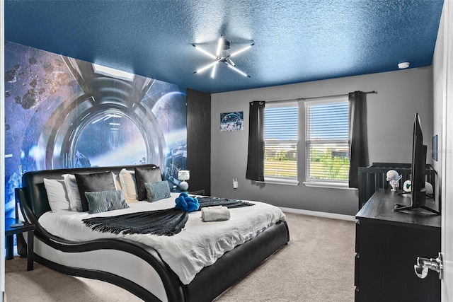 bedroom with carpet flooring and a textured ceiling