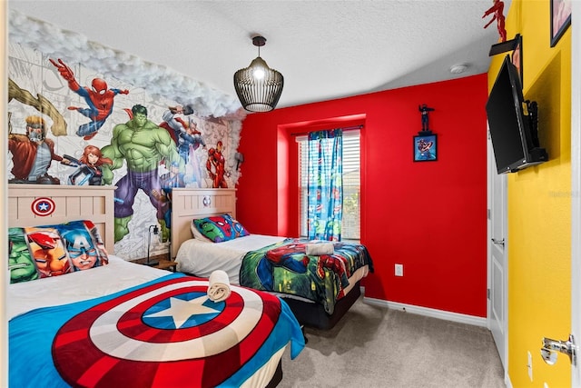 bedroom featuring carpet flooring and a textured ceiling