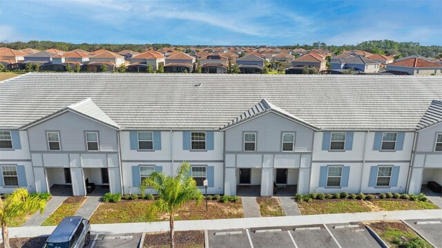 7614 Oak Spring Ln, Davenport, FL 33837 - view of front facade featuring uncovered parking and a residential view