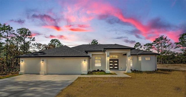 prairie-style home featuring a garage