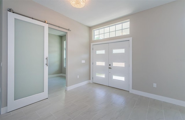 entrance foyer with a barn door