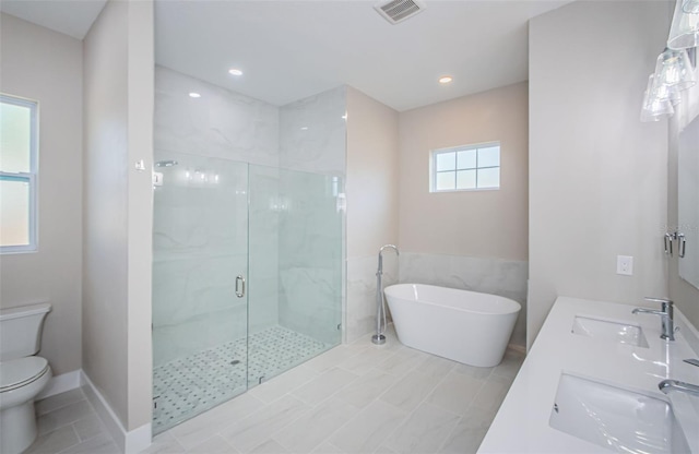 full bathroom featuring tile patterned floors, toilet, sink, and shower with separate bathtub