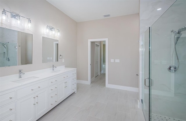 bathroom featuring vanity and walk in shower