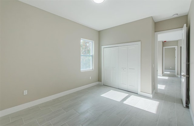 unfurnished bedroom with a closet