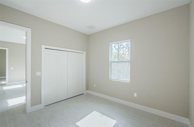 unfurnished bedroom featuring a closet