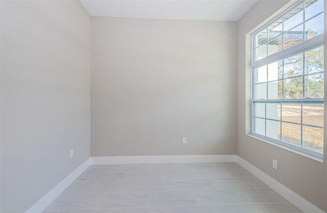 empty room featuring light tile patterned flooring