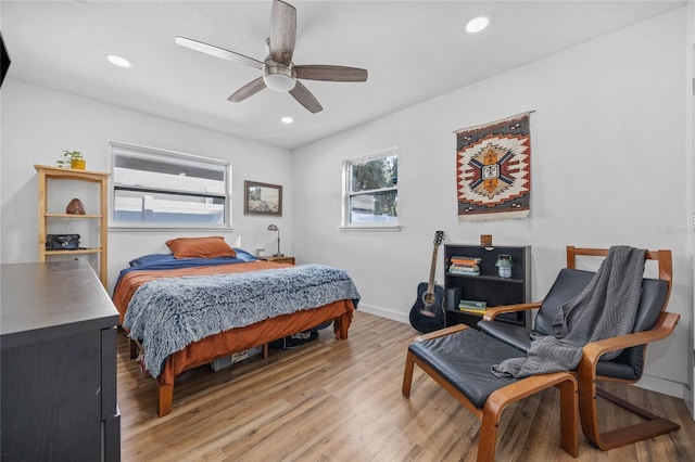 bedroom featuring ceiling fan and light hardwood / wood-style flooring