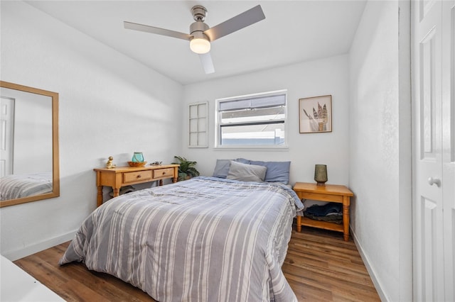 bedroom featuring wood-type flooring and ceiling fan