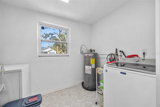 laundry area with water heater and washer and dryer