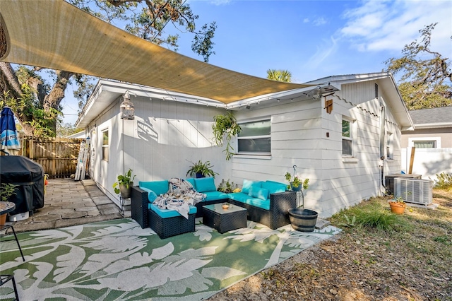 back of property featuring an outdoor living space, a patio, and cooling unit