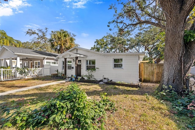 ranch-style home with a front lawn