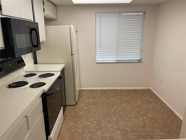 kitchen featuring black microwave, white cabinetry, baseboards, light countertops, and electric range oven